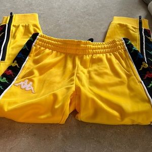 Kappa track pants size six.